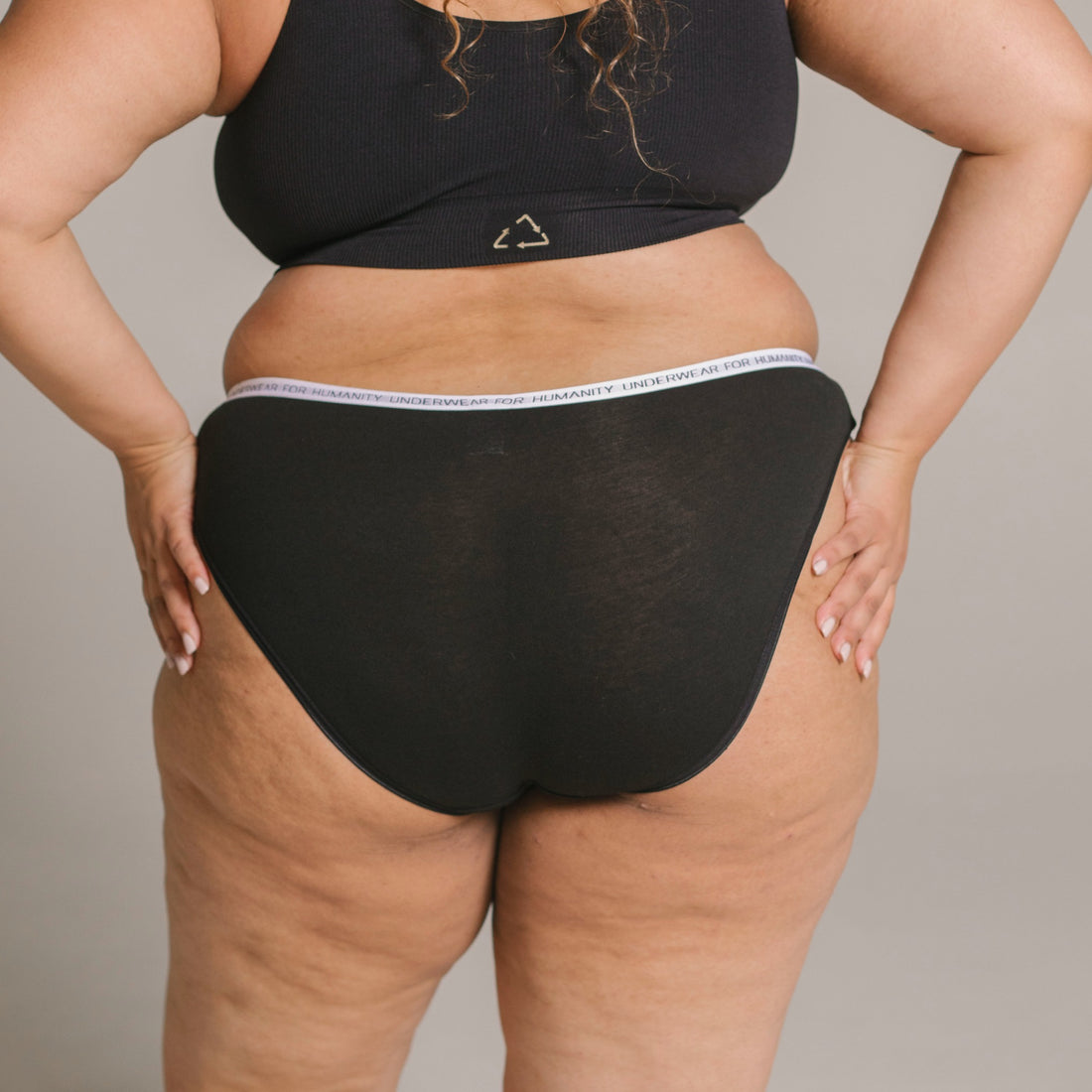 Organic cotton bikini briefs in black – eco-friendly and sustainable underwear.&quot;
