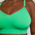 Sustainable, ethically produced apple wireless bra by Underwear for Humanity. For DD-GG cup sizes. Recycled materials, flexible, supportive. Knitted bra and band, adjustable straps. Model wears the DD+ bra.