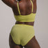 Sustainable, ethically made Lime high waist seam free brief by Underwear for Humanity: Flexible and comfortable, stretches across sizes. Models wear high waisted ethical underwear. Underwear is made from recycled nylon and sits high on the waist, full seat coverage and smooth on the body.