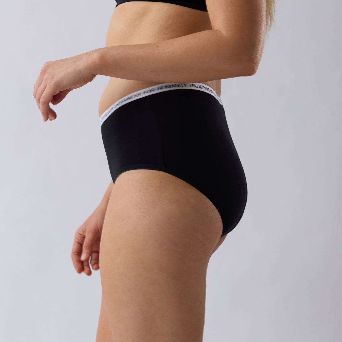 Underwear for Humanity Organic Cotton Midi Brief in Black, a lower-rise women’s underwear style with a lower-cut leg, soft breathable fabric and comfortable everyday coverage