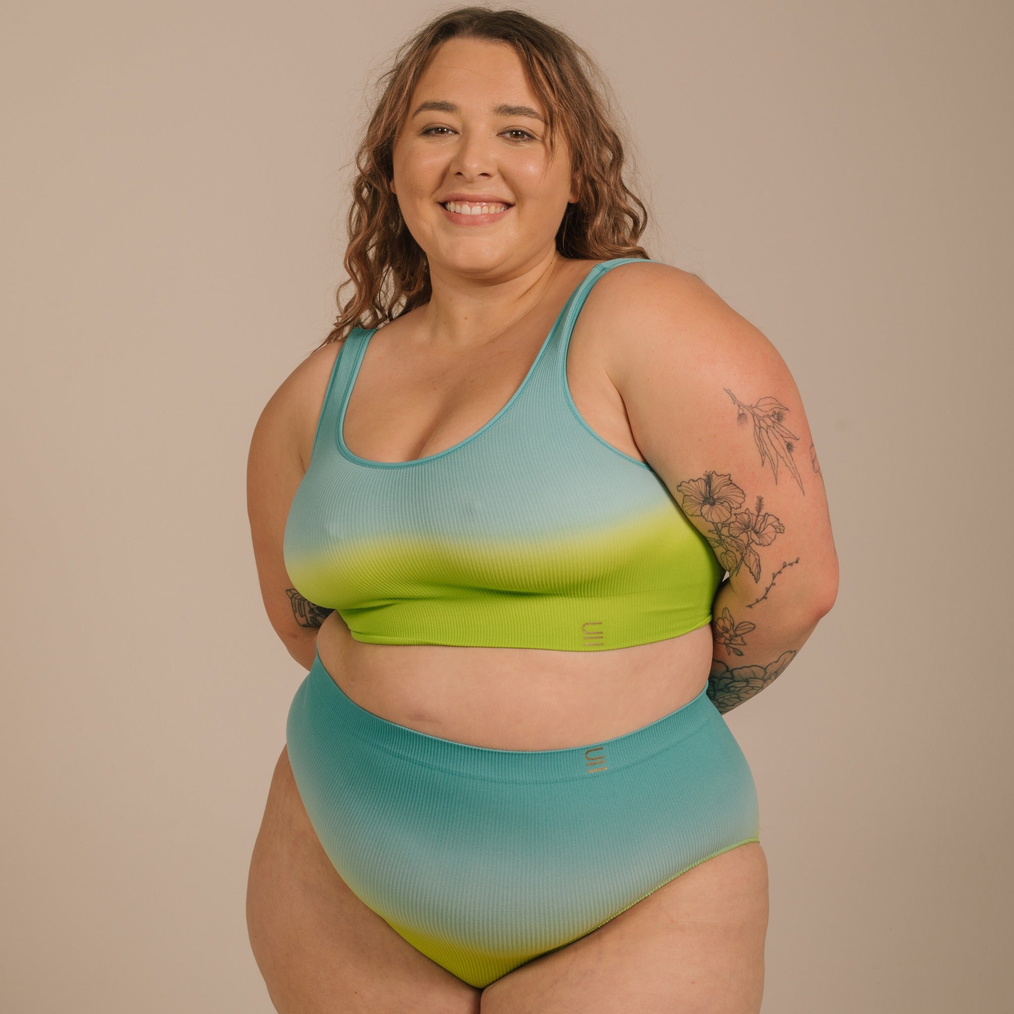 Sustainable, ethically made ocean high waist seam free brief by Underwear for Humanity: Flexible and comfortable, stretches across sizes. Models wear high waisted ethical underwear. Underwear is made from recycled nylon and sits high on the waist, full seat coverage and smooth on the body.