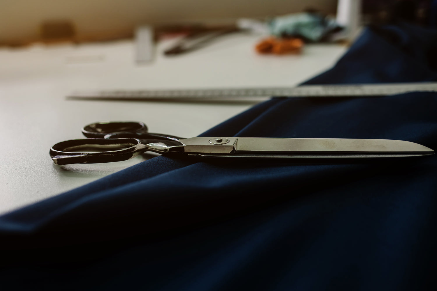 Scissors laying on fabric