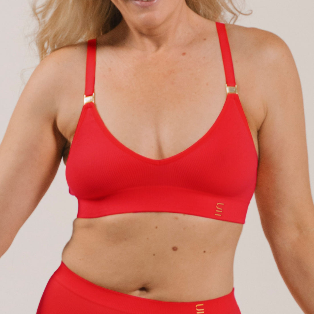 Sustainable, ethically produced flame wireless bra by Underwear for Humanity. A -D cup sizes. Recycled materials, flexible, supportive. Knitted bra and band, adjustable straps. Models wear the A-D bra.