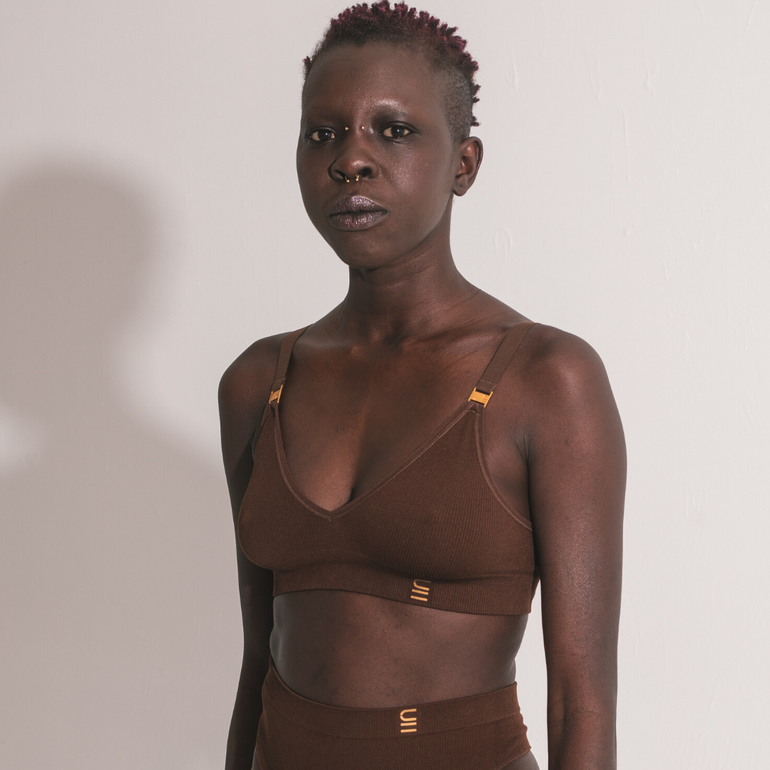 Sustainable, ethically produced  nude 6 - dark skin tonewireless bra by Underwear for Humanity. For DD-GG cup sizes. Recycled materials, flexible, supportive. Knitted bra and band, adjustable straps. Model wears the DD+ bra.