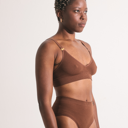 Sustainable, ethically produced Nude 5- medium dark skin tone wireless bra by Underwear for Humanity. A -D cup sizes. Recycled materials, flexible, supportive. Knitted bra and band, adjustable straps. Models wear the A-D bra.