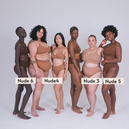 Sustainable, ethically produced  nude 6 - dark skin tonewireless bra by Underwear for Humanity. For DD-GG cup sizes. Recycled materials, flexible, supportive. Knitted bra and band, adjustable straps. Model wears the DD+ bra.