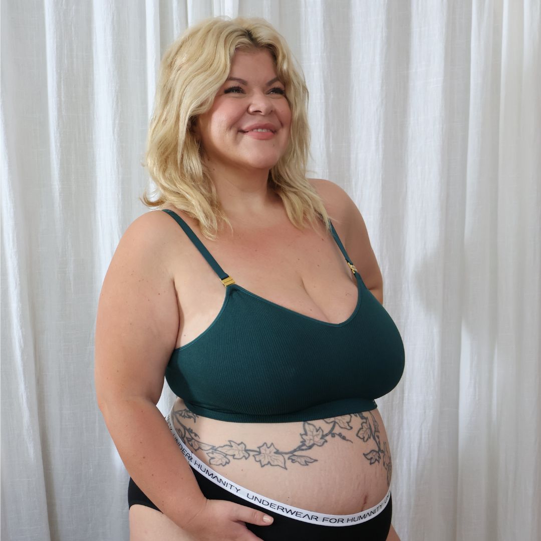 Sustainable atlantis wireless maternity bra by Underwear For Humanity: ethical, sustainable. A -D and DD-GG cup sizes. Recycled materials, flexible, supportive, pregnancy, feeding, convertible. Knitted bra and band, adjustable straps. Model showcases maternity bra