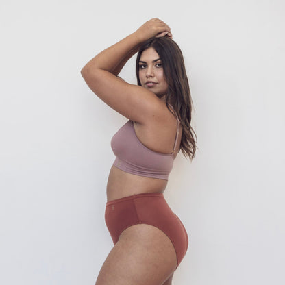 Sustainable clay high waist brief by Underwear for Humanity: ethical, sustainable. sizes 6-26. light, breathable. Models wear high-waisted underwear. underwear sits high on the waist, full seat coverage. smooth under clothing. made from Tencel and recycled materials