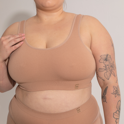 Sustainable, ethically produced nude 3- light beige skin tone bra crop by Underwear for Humanity: stronger support for larger bust, D - GG cup sizes. Recycled materials, knitted bra and band, seamfree, made from recycled nylon. Models wear the D+ Crop