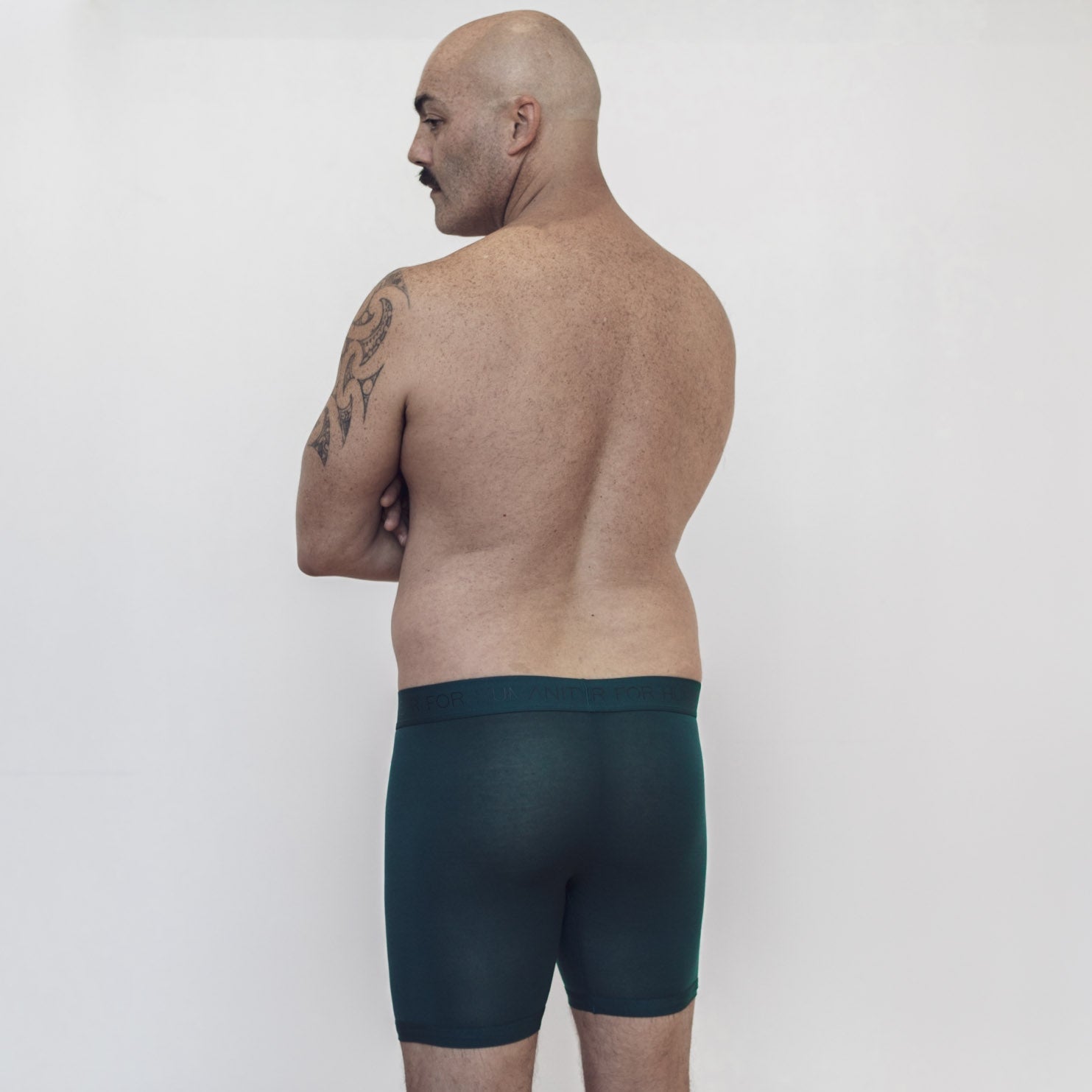 Sustainable, ethically made atlantis trunk style underwear. Long leg, wide thigh fit with elastic bind, no riding, cup support close to the body. made with tencel fabric and recycled elastic, thin, no dig waist band. Model wears shorts