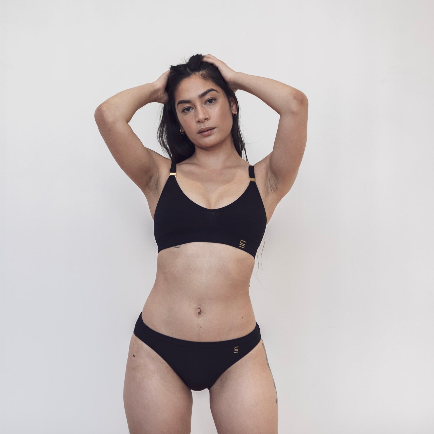 Sustainable black bikini brief by Underwear for Humanity. ethical, sustainable. Lower rise, full coverage seat, soft tencel, breathable. 