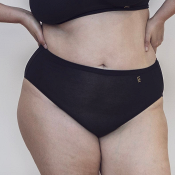 Sustainable black high waist brief by Underwear for Humanity: ethical, sustainable. sizes 6-26. light, breathable. Models wear high-waisted underwear. underwear sits high on the waist, full seat coverage. smooth under clothing. made from Tencel and recycled materials