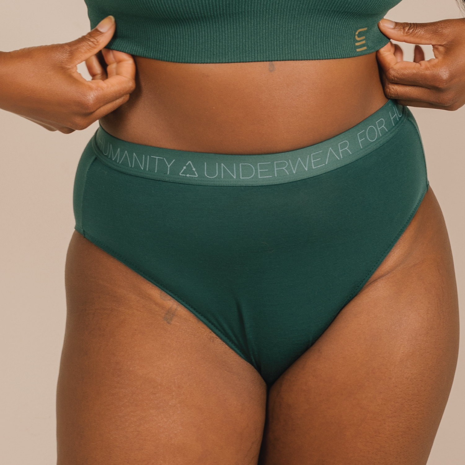 Sustainable atlantis high waist brief by Underwear for Humanity: ethical, sustainable. sizes 6-30 light, breathable. Models wear high-waisted underwear. underwear sits high on the waist, full seat coverage. smooth under clothing. made from Tencel and recycled materials, attached no-dig recycled elastic waist band.